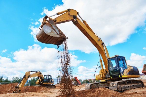 excavator unloading dirt