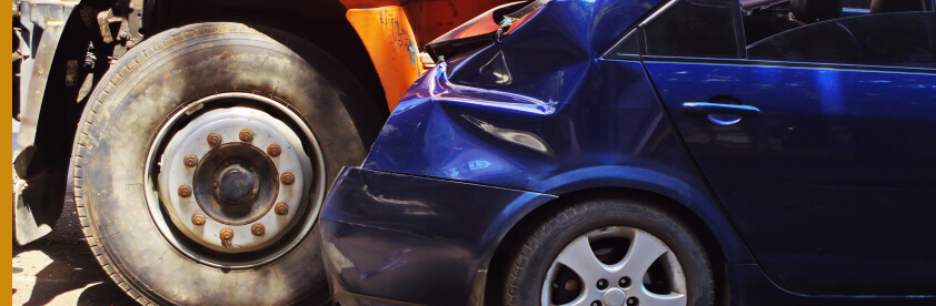 close-up of a blue car with damage sustained from an accident