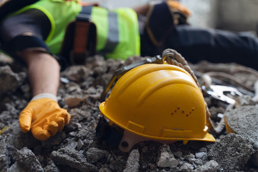 construction worker laying on ground