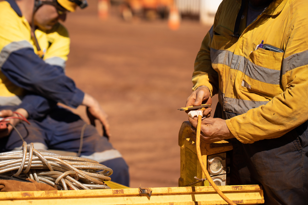 construction workers working with electrical equipment on jobsite