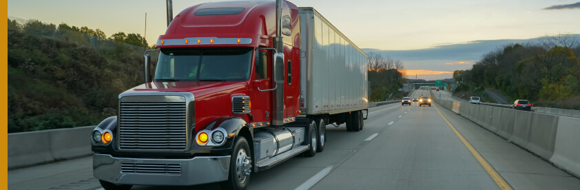 semi-truck driving down highway