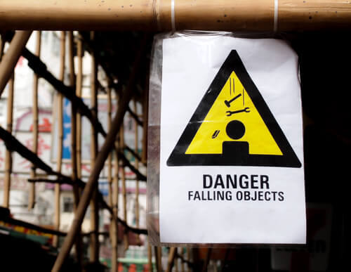 danger falling objects sign places on scaffolding at NYC construction site
