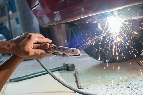 worker performing a welding task