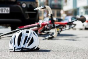 Bicycling helmet fallen on asphalt