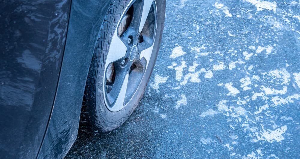 car driving on road covered in black ice, how is liability placed?