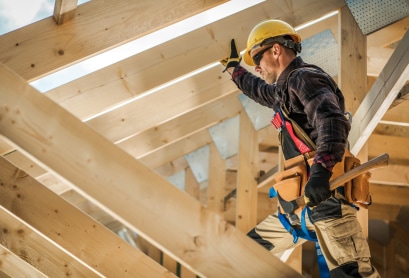 construction worker working on foundation rafters