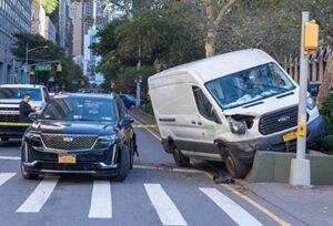 NEW YORK, NEW YORK - OCTOBER 13: A car crash scene were a transit hit a car service stopped at a traffic light seen on October 13, 2023 in New York City.