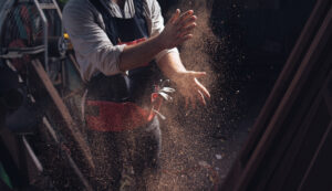 man cleaning his hands from work dust