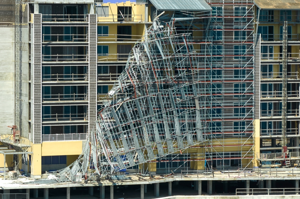 collapsed scaffolding structure on construction building site showing severe safety failure